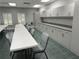 Community room with tables, chairs, and kitchen at 21630 King Henry Ave, Leesburg, FL 34748