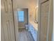 Spacious bathroom with double vanity and large mirror at 21630 King Henry Ave, Leesburg, FL 34748