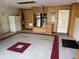 Garage with tiled floor, HVAC unit, and built-in storage at 21630 King Henry Ave, Leesburg, FL 34748