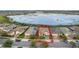 Aerial view of a house near a lake at 256 Silver Maple Rd, Groveland, FL 34736