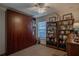 Home office with built-in wall unit, desk, and ample shelving for storage at 3332 Flagship Ave, Tavares, FL 32778