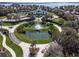 Community clubhouse with a circular driveway and fountain at 3332 Flagship Ave, Tavares, FL 32778