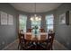 Cozy dining room with a round wooden table and seating for six at 3332 Flagship Ave, Tavares, FL 32778