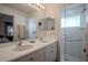 Double vanity bathroom with a large walk-in shower and plenty of counter space at 3332 Flagship Ave, Tavares, FL 32778