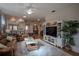 Spacious living room featuring comfortable seating, large TV, and decorative accents at 3332 Flagship Ave, Tavares, FL 32778