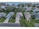 Aerial view of a lakefront community with houses and lush landscaping at 3332 Flagship Ave, Tavares, FL 32778