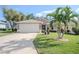 Charming house with landscaping and a two-car garage at 3332 Flagship Ave, Tavares, FL 32778