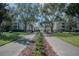 Gated community entrance with clock tower at 3406 Soho St # 102, Orlando, FL 32835