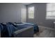 Bedroom with a comfortable sofa bed and two windows at 3406 Soho St # 102, Orlando, FL 32835