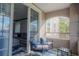 Balcony with sliding glass doors and comfy seating at 3406 Soho St # 102, Orlando, FL 32835