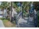 Wooden stairs leading to a lakefront walkway at 3406 Soho St # 102, Orlando, FL 32835