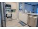 Modern kitchen with stainless steel appliances and white cabinets at 3406 Soho St # 102, Orlando, FL 32835