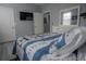 Bedroom with a queen bed, TV and additional closet space at 3406 Soho St # 102, Orlando, FL 32835