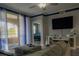 Living room with comfortable couch and access to balcony at 3406 Soho St # 102, Orlando, FL 32835