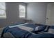 Well-lit bedroom with a comfortable bed and neutral color palette at 3406 Soho St # 102, Orlando, FL 32835