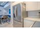 Modern kitchen with stainless steel refrigerator and white cabinets at 3406 Soho St # 102, Orlando, FL 32835