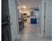 View of a bright and airy entryway with a view of kitchen and dining area at 3406 Soho St # 102, Orlando, FL 32835