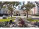Gated entrance to community with landscaping and benches at 3406 Soho St # 102, Orlando, FL 32835