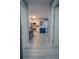 View of a bright and airy entryway with a view of kitchen and dining area at 3406 Soho St # 102, Orlando, FL 32835