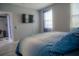 Bedroom with king-size bed and mounted TV at 3406 Soho St # 102, Orlando, FL 32835