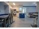 Kitchen and dining area with gray flooring and a modern table at 3406 Soho St # 102, Orlando, FL 32835