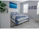 Bright bedroom with a queen-size bed and lake-themed decor at 3406 Soho St # 102, Orlando, FL 32835