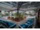 Relaxing poolside seating under a pergola at 3406 Soho St # 102, Orlando, FL 32835