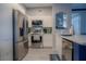 Modern kitchen with stainless steel appliances and white cabinets at 3406 Soho St # 102, Orlando, FL 32835
