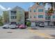 Three-story apartment building with parking in front at 3406 Soho St # 102, Orlando, FL 32835