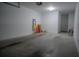 Garage with space for storage and a door to the house at 3406 Soho St # 102, Orlando, FL 32835