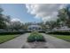 Relaxing gazebo in a landscaped community setting with lush greenery at 3406 Soho St # 102, Orlando, FL 32835