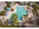 Overhead view of refreshing pool with surrounding lounge chairs at 3406 Soho St # 102, Orlando, FL 32835