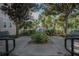Seating area with tranquil lake view through trees at 3406 Soho St # 102, Orlando, FL 32835