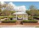 Quaint gazebo nestled in landscaped garden with brick walkways at 3406 Soho St # 102, Orlando, FL 32835