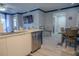 Modern kitchen with island and stainless steel dishwasher at 3406 Soho St # 102, Orlando, FL 32835