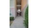 Building exterior with walkway leading to stairwell and two-story structure at 3406 Soho St # 102, Orlando, FL 32835