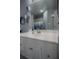 Bathroom with white vanity and large mirror at 3406 Soho St # 102, Orlando, FL 32835
