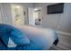 Bedroom with king bed, en-suite bathroom, and view of living area at 3406 Soho St # 102, Orlando, FL 32835