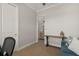 Home office with a desk and view into living room at 38805 Ranch Gate Blvd, Umatilla, FL 32784