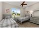 Twin bedroom with two beds and a shared dresser at 38805 Ranch Gate Blvd, Umatilla, FL 32784