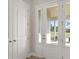 Bright entryway with white door and view of backyard at 38805 Ranch Gate Blvd, Umatilla, FL 32784