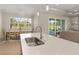 Kitchen island with sink and breakfast bar overlooking dining area at 38805 Ranch Gate Blvd, Umatilla, FL 32784