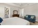 Secondary bedroom with sitting area and access to patio at 38805 Ranch Gate Blvd, Umatilla, FL 32784