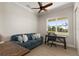 Bright office with a comfortable sofa and a large window at 38805 Ranch Gate Blvd, Umatilla, FL 32784