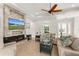 Living room with a modern fireplace and plenty of natural light at 38805 Ranch Gate Blvd, Umatilla, FL 32784