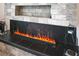 Close-up view of modern linear fireplace with realistic flame effect at 38805 Ranch Gate Blvd, Umatilla, FL 32784