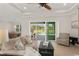 Spacious living area with sliding glass doors leading to the pool area at 38805 Ranch Gate Blvd, Umatilla, FL 32784
