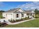 Aerial view of a single-story house with a two-car garage at 38805 Ranch Gate Blvd, Umatilla, FL 32784