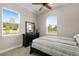 Secondary bedroom with two windows and dresser at 38805 Ranch Gate Blvd, Umatilla, FL 32784