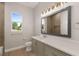 Modern bathroom with a large mirror and updated vanity at 38805 Ranch Gate Blvd, Umatilla, FL 32784